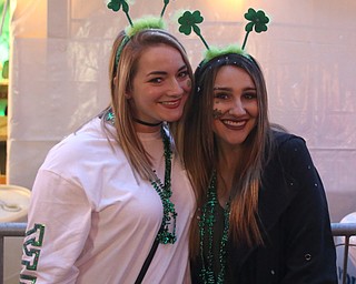 Abby Kenski of Erie and Adrian Schultz of Long Beach, Calif. pose for a photo outside of The Federal during Sham-Rock on the Block, Friday, March 17, 2017, in downtown Youngstown. ..(Nikos Frazier | The Vindicator)..