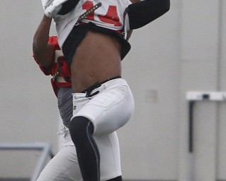 Youngstown senior free safety Solomon Warfield(14) goes up for a catch during practice at the Watson and Tressel Training Site, Friday, March 17, 2017, in Youngstown. ..(Nikos Frazier | The Vindicator)..