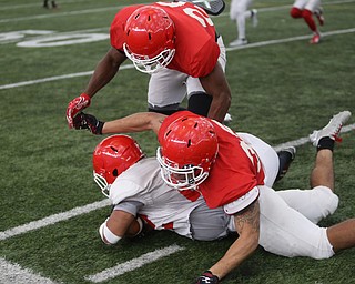 Tackled during practice at the Watson and Tressel Training Site, Friday, March 17, 2017, in Youngstown. ..(Nikos Frazier | The Vindicator)..