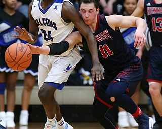 MICHAEL G TAYLOR | THE VINDICATOR- 03-17-17  -Basketball- 4th qtr, JFK's #11 Alec Burzynski steals the from  Falcon's #24 Travis Sanders.  D4 Regional Final, Cleve Luthern East Falcons vs JFK Eagles at Canton Fieldhouse in Canton, OH