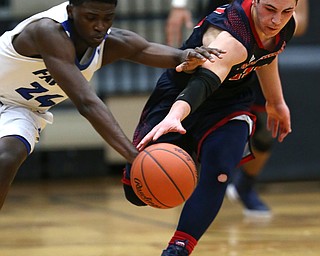 MICHAEL G TAYLOR | THE VINDICATOR- 03-17-17  -Basketball- 4th qtr, JFK's #11 Alec Burzynski steals the from  Falcon's #24 Travis Sanders.  D4 Regional Final, Cleve Luthern East Falcons vs JFK Eagles at Canton Fieldhouse in Canton, OH