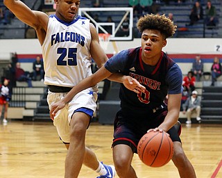 MICHAEL G TAYLOR | THE VINDICATOR- 03-17-17  -Basketball- 1st qtr, JFK's #0 Hyland Burton drives to the hoop against Falcon's #25 Jordan Burge.  D4 Regional Final, Cleve Luthern East Falcons vs JFK Eagles at Canton Fieldhouse in Canton, OH