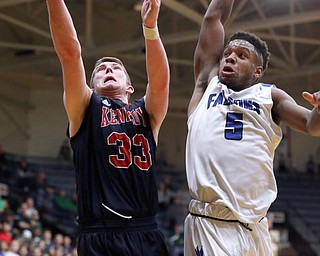 MICHAEL G TAYLOR | THE VINDICATOR- 03-17-17  -Basketball-2nd qtr, JFK's #33 Justin Bofenkamp drives to the hoop against Falcon's #5 Kaylin Heard.  D4 Regional Final, Cleve Luthern East Falcons vs JFK Eagles at Canton Fieldhouse in Canton, OH