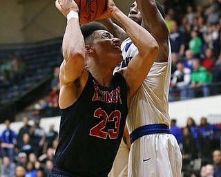 MICHAEL G TAYLOR | THE VINDICATOR- 03-17-17  -Basketball- 4th qtr, JFK's #23 Antonio McQueen  drives against the Falcon's #35 Justin Motley.  D4 Regional Final, Cleve Luthern East Falcons vs JFK Eagles at Canton Fieldhouse in Canton, OH