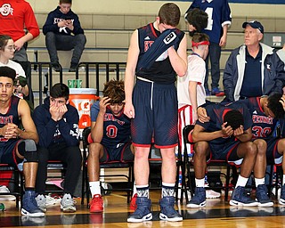 MICHAEL G TAYLOR | THE VINDICATOR- 03-17-17  -Basketball-  JFKteam is crestfallen over their loss.  D4 Regional Final, Cleve Luthern East Falcons vs JFK Eagles at Canton Fieldhouse in Canton, OH