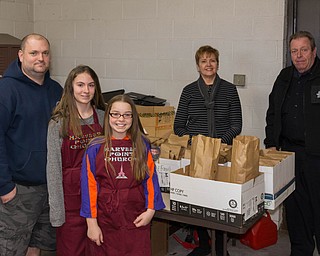 SPECIAL TO THE VINDICATOR
Harvest Point Church in Lordstown donated homemade soup and crackers to local families March 6 with the cooperation of Lordstown Police Department. Church members and youths who participated, from left, were Jeff Pandrea, Caitlynn Grimm, Ashley Pandrea and Arleen Campbell and Lordstown Police Officer George Ebling.