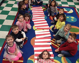SPECIAL TO THE VINDICATOR
Students in Barbara Conti’s preschool enrichment class at Ursuline Preschool and Kindergarten recently celebrated Dr. Seuss with activities and readings. One of the activities was creating a red and white hat after reading “The Cat in the Hat.” Counter-clockwise, from left, are Giavanna Italiano, Garrett Scarsella, Ella Morse, Bristol Orr, Grace Shaw, Iyla Khan, Miranda Thomas, Ty Porter, Ryder Davis, Ella Pfahler, Laya Thomas, Kaeden Williams, Tatem Poultney, Ava Peluso, Andrew Tuscano and Kendall Kaleel at the bottom of the hat.