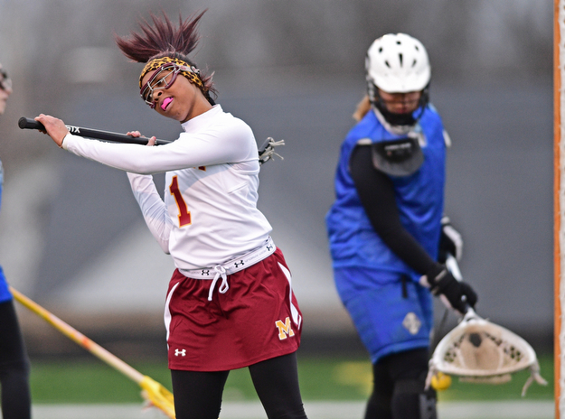 YOUNGSTOWN, OHIO - MARCh 20, 2017: Taylor Harris #1 of Mooney celibates after scoring a goal during the first half of their game Monday evening at Mooney High School. DAVID DERMER | THE VINDICATOR