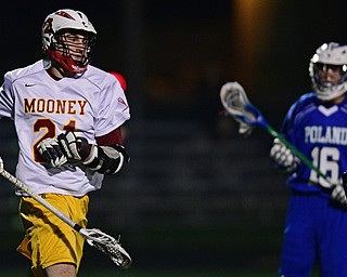 YOUNGSTOWN, OHIO - MARCh 20, 2017: Michael Phillips #21 of Mooney pumps his fist after scoring a goal during the first half of their game Monday night at Mooney High School. DAVID DERMER | THE VINDICATOR