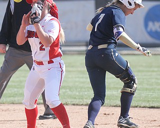 William D. Lewis The Vindicator  Akron's Ashley Sims(7) is safe at 2nd as YSU's  Brittney Moffatt(2) loses control of the ball during 3-21-17 game at YSU.