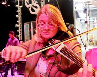 William D. Lewis The Vindicator Boardman HS 12th grade violinist Lizzie George during rehersal for Project Mayhem concert.