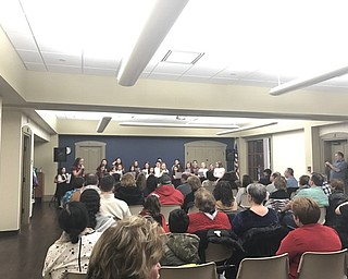Neighbors | Alexis Bartolomucci.Guests at the Boardman library gathered to listen to the St. Charles Youth Choir perform during the Celebrate the Arts opening night on March 2.