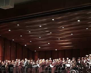 Neighbors | Alexis Bartolomucci.The symphonic band took a bow at the end of their performance for the Winter Concert on March 2.