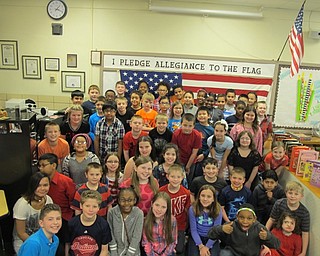 Neighbors | Alexis Bartolomucci.The fourth-grade students stood in front of an American flag after having a celebration about completing their American Revolution reading workshop on March 9 at Robinwood Lane Elementary.