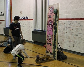 Neighbors | Abby Slanker.A C.H. Campbell Elementary School student tried his hand at the Ring the Bell game during the school’s annual ‘Under the Sea’ Spring Fest on March 10.