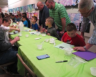 Neighbors | Alexis Bartolomucci.Guests at the My Son is a Mad Scientist event at Dobbins Elementary on March 9 made their own slime.