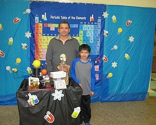 Neighbors | Alexis Bartolomucci.Mark and Connor Casey are pictured at the science photo station during the My Son is a Mad Scientist event at Dobbins Elementary on March 9.