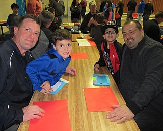 Neighbors | Alexis Bartolomucci.Paul and Bradley Burgoyne decorated a picture frame with Nick and Kosta Kalicatsaros during the My Son is a Mad Scientist event on March 9 at Dobbins Elementary.