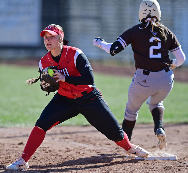YOUNGSTOWN, OHIO - MARCH 23, 2017: First basemen Kelly Thompson-Cappadocio #7 of YSU keeps her foot on the bag after firing out Desiree Gonzalez #2 of St. Bonaventure in the 5th inning of game one, Thursday afternoons game at Youngstown State. DAVID DERMER | THE VINDICATOR