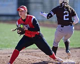 YOUNGSTOWN, OHIO - MARCH 23, 2017: First basemen Kelly Thompson-Cappadocio #7 of YSU keeps her foot on the bag after firing out Desiree Gonzalez #2 of St. Bonaventure in the 5th inning of game one, Thursday afternoons game at Youngstown State. DAVID DERMER | THE VINDICATOR