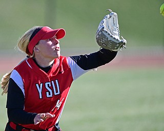 YOUNGSTOWN, OHIO - MARCH 23, 2017: Left fielder Sarah Dowd #14 of YSU gets under the fly ball for the out in the sixth inning of game one, Thursday afternoons game at Youngstown State. DAVID DERMER | THE VINDICATOR