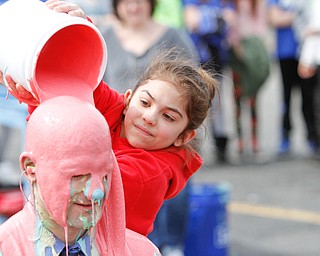        ROBERT K. YOSAY  | THE VINDICATOR..and as it continued  Sammie Massucci  4th grade..... pours on the pink slime...  slimes Mr Michael Daley..Poland  Dobbins Elementary students get to slime their principal after beating a read-a-thon challenge in which students read over 145,579 mintues and raised over a 11,000 dollars as they got to slime the principal Michael Daley (ok).....-30-