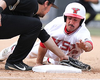 William D Lewis The vindicator  YSU's Nico Padovan(32) is picked off at first by Oakland's Zack Sterry(5) during 3-24-17 opener at Eastwood.