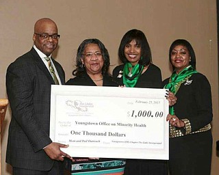 Above, Dr. Rodney E. Hill, left, honorary event chairman, presented a $1,000 donation to Leigh Greene of the Youngstown Office on Minority Health, to aid in reducing the infant mortality rate in Youngstown. Also presenting the check are Ruthie King, brunch chairman, and Marge Staples, The Links Inc. chapter president. Black Diamond recipients for 2017 are pictured below. SPECIAL TO THE VINDICATOR