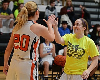 WARREN, OHIO - MARCH 28, 2017: Abby White of Champion gets a high five from Sara Price of Howland after draining 18 three point shots during halftime of the Frank Bubba Girls All Star Game, Tuesday night at Warren Harding High School. DAVID DERMER | THE VINDICATOR