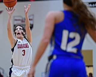WARREN, OHIO - MARCH 28, 2017: Dakota Naples #3 of Niles puts up a three point shot over Katelyn Totani #12 of Jackson Milton during the second half of the Frank Bubba Girls All Star Game, Tuesday night at Warren Harding High School. DAVID DERMER | THE VINDICATOR