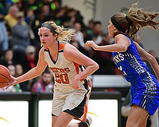 WARREN, OHIO - MARCH 28, 2017: Sara Price #20 of Howland drives on Ashley Totani #11 of Jackson Milton during the second half of the Frank Bubba Girls All Star Game, Tuesday night at Warren Harding High School. DAVID DERMER | THE VINDICATOR