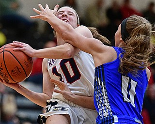 WARREN, OHIO - MARCH 28, 2017: Antonella Lamonica #10 of JFK goes to the basket while being pressured by Ashley Totani #11 of Jackson Milton during the second half of the Frank Bubba Girls All Star Game, Tuesday night at Warren Harding High School. DAVID DERMER | THE VINDICATOR