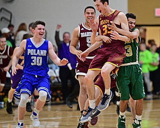 WARREN, OHIO - MARCH 28, 2017: Anthony Ritter #33 of South Range is hugged by teammate Anise Algahemy #3 after nailing a game winning three at the buzzer during the second half of the Frank Bubba Boys All Star Game, Tuesday night at Warren Harding High School. DAVID DERMER | THE VINDICATOR