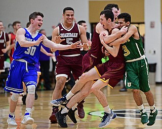 WARREN, OHIO - MARCH 28, 2017: Anthony Ritter #33 of South Range is hugged by teammates Anise Algahemy #3 and Dan Ritter #11 after nailing a game winning three at the buzzer during the second half of the Frank Bubba Boys All Star Game, Tuesday night at Warren Harding High School. DAVID DERMER | THE VINDICATOR