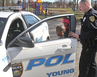 William D. Lewis The Vindicator   YPD Ptlm Steven Gibson in Homestead park where he befriended some local kids and became a star on facebook. He is shown here showing his cruiser to  siblings Nijah, 11, and Colde Adams, 8. Both are from Youngstown.