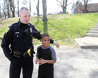 William D. Lewis The Vindicator   YPD Ptlm Steven Gibson in Homestead park where he befriended some local kids and became a star on facebook. He is shown here with Colde Adams, 8. He is from Youngstown.