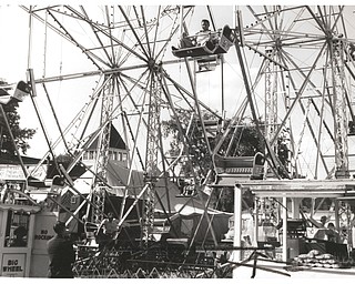 Fairgoers enjoy the Ferris wheels at the 1954 Canfield Fair.