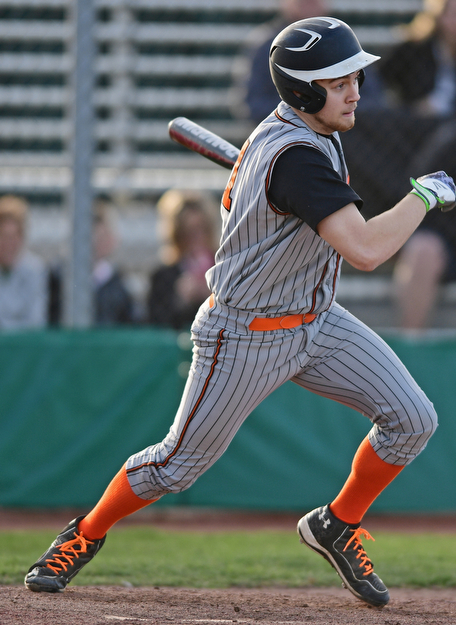 STRUTHERS, OHIO - MARCH 29, 2017: Batter Frank Manious #21 of Howland singles driving in two runs in the fourth inning of Wednesday nights game at Cene Park. DAVID DERMER | THE VINDICATOR