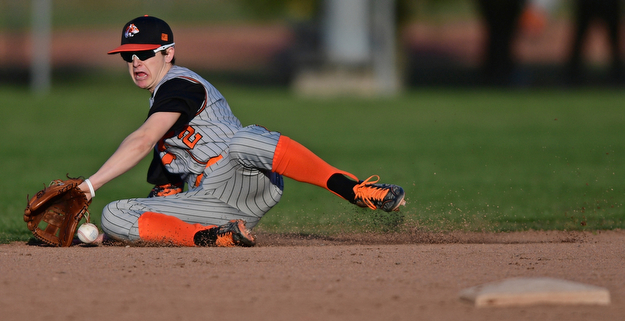 STRUTHERS, OHIO - MARCH 29, 2017: Second basemen Zachary Campbell #2 of Howland dives in a unsuccessful attempt to field the ball in the fifth inning of Wednesday nights game at Cene Park. DAVID DERMER | THE VINDICATOR