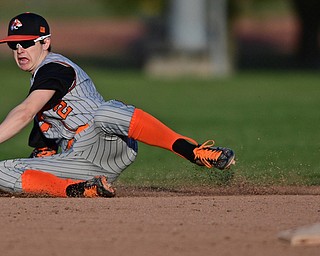 STRUTHERS, OHIO - MARCH 29, 2017: Second basemen Zachary Campbell #2 of Howland dives in a unsuccessful attempt to field the ball in the fifth inning of Wednesday nights game at Cene Park. DAVID DERMER | THE VINDICATOR