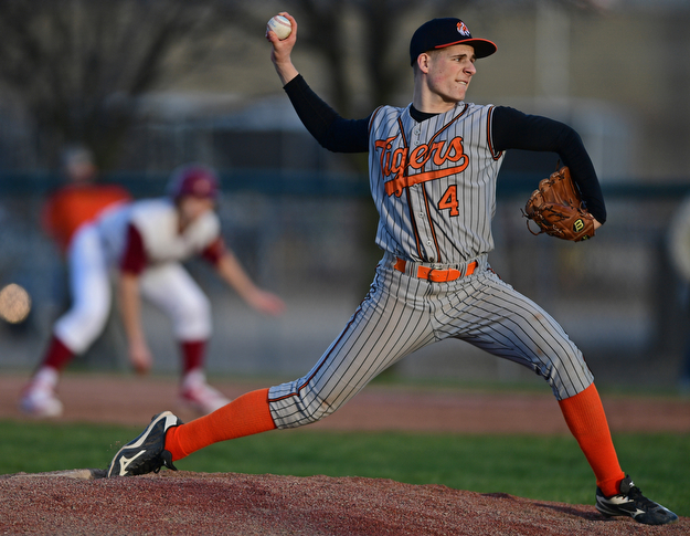 STRUTHERS, OHIO - MARCH 29, 2017: Starting pitcher Michael Massucci #4 of Howland delivers in the fifth inning of Wednesday nights game at Cene Park. DAVID DERMER | THE VINDICATOR