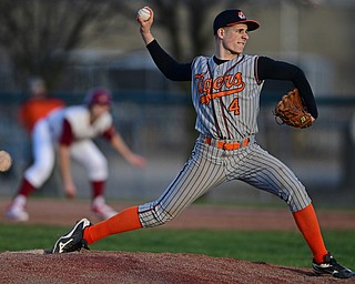 STRUTHERS, OHIO - MARCH 29, 2017: Starting pitcher Michael Massucci #4 of Howland delivers in the fifth inning of Wednesday nights game at Cene Park. DAVID DERMER | THE VINDICATOR