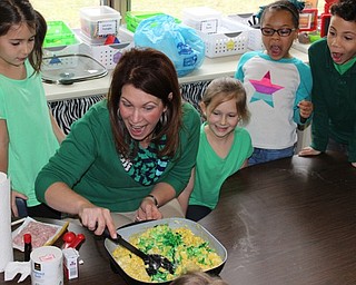 Neighbors | Abby Slanker.C.H. Campbell Elementary School kindergartens looked on in amazement as their teacher, Tammy Sabrin, stirred in green food coloring to make green eggs and ham to honor Dr. Seuss’ birthday on March 2.