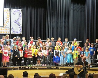 Neighbors | Alexis Bartolomucci.Music instructor Dean Wilson played the guitar while the kindergarten students sang during their concert on March 8 at Poland Seminary High School.