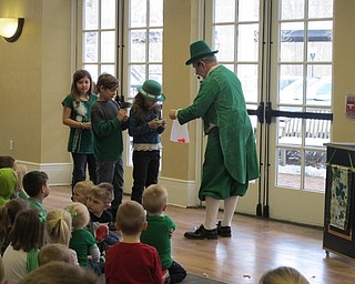 Neighbors | Alexis Bartolomucci.Fritz Coombs, also known as Merlin, did some magic tricks with children at the Poland library on March 11.