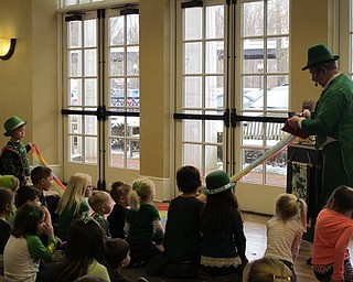 Neighbors | Alexis Bartolomucci.One of the children at the Poland library's Leprechaun Lollapalooza celebration helped the magician, Merlin, with one of his magic tricks on March 11.