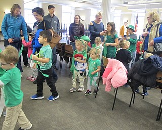 Neighbors | Alexis Bartolomucci.The children lined up and held streamers as they prepared to march around the Poland library for the St. Patrick's parade on March 11.