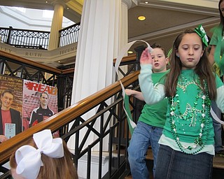 Neighbors | Alexis Bartolomucci.Children walked down the stairs of the Poland library waving streamers during the St. Patrick's parade on March 11.