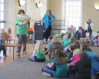 Neighbors | Alexis Bartolomucci.Children sat and listened to a story during the Poland library's Leprechaun Lollapalooza program on March 11.