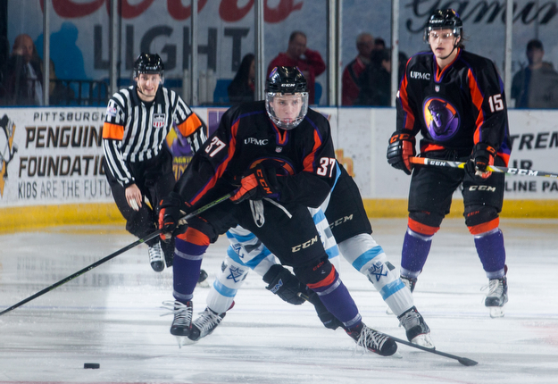 Scott R. Galvin | The Vindicator.Youngstown Phantoms forward Max Ellis (37) skates the puck up ice during the first period against the  Lincoln Stars  at the Covelli Centre on April 1, 2017...